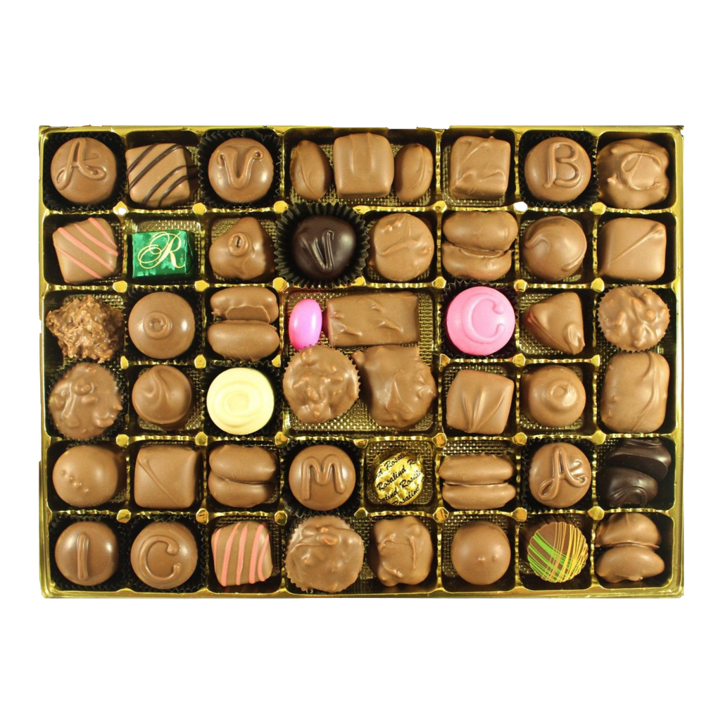 Assorted chocolate candies in a gold box on a white background