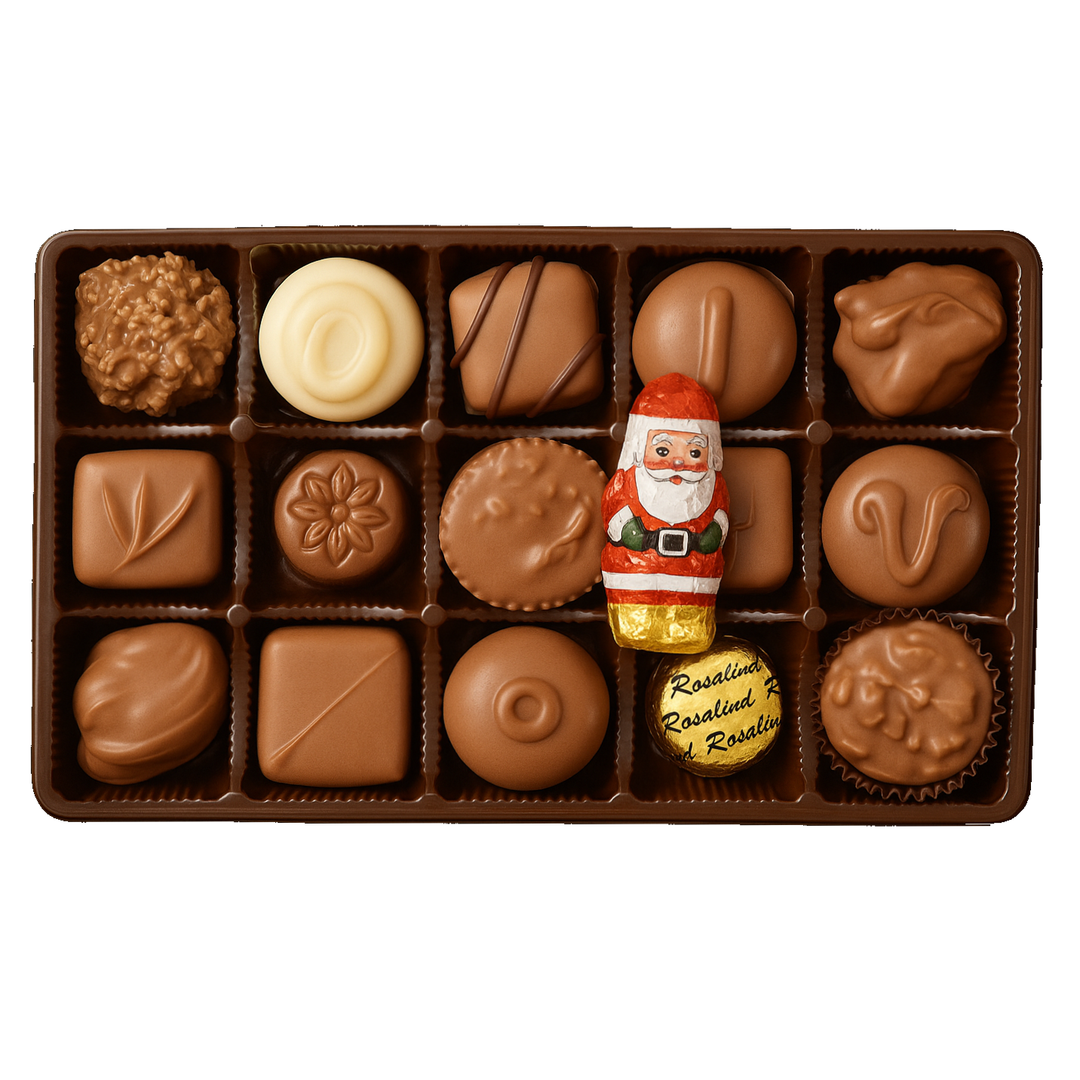 Assorted chocolates in a box with a Santa Claus figure on a white background